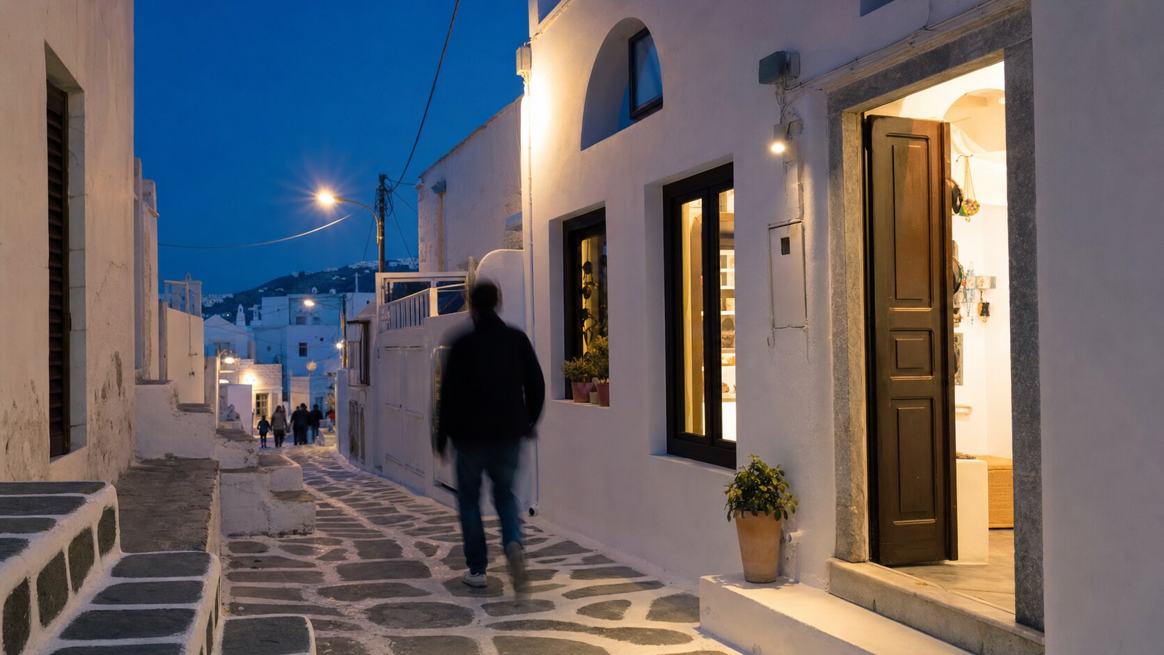 Blue hour street photography scene in Greece during a guided photography tour, showing the kind of low-light composition tour photographers cover