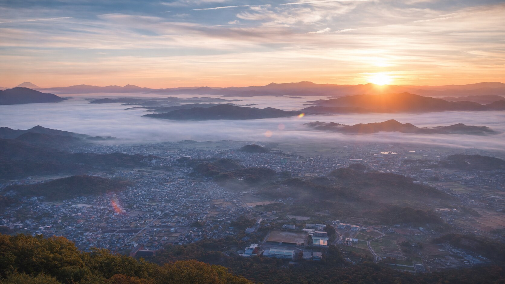 Sunrise aerial-style view of Japan, the signature opening shot most photography tours begin with