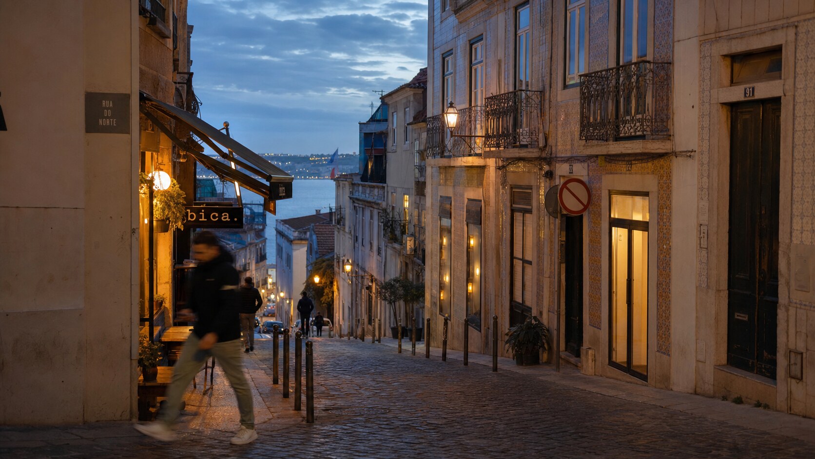 Blue hour street photography scene in Lisbon during a guided photography tour, showing the kind of low-light composition tour photographers cover