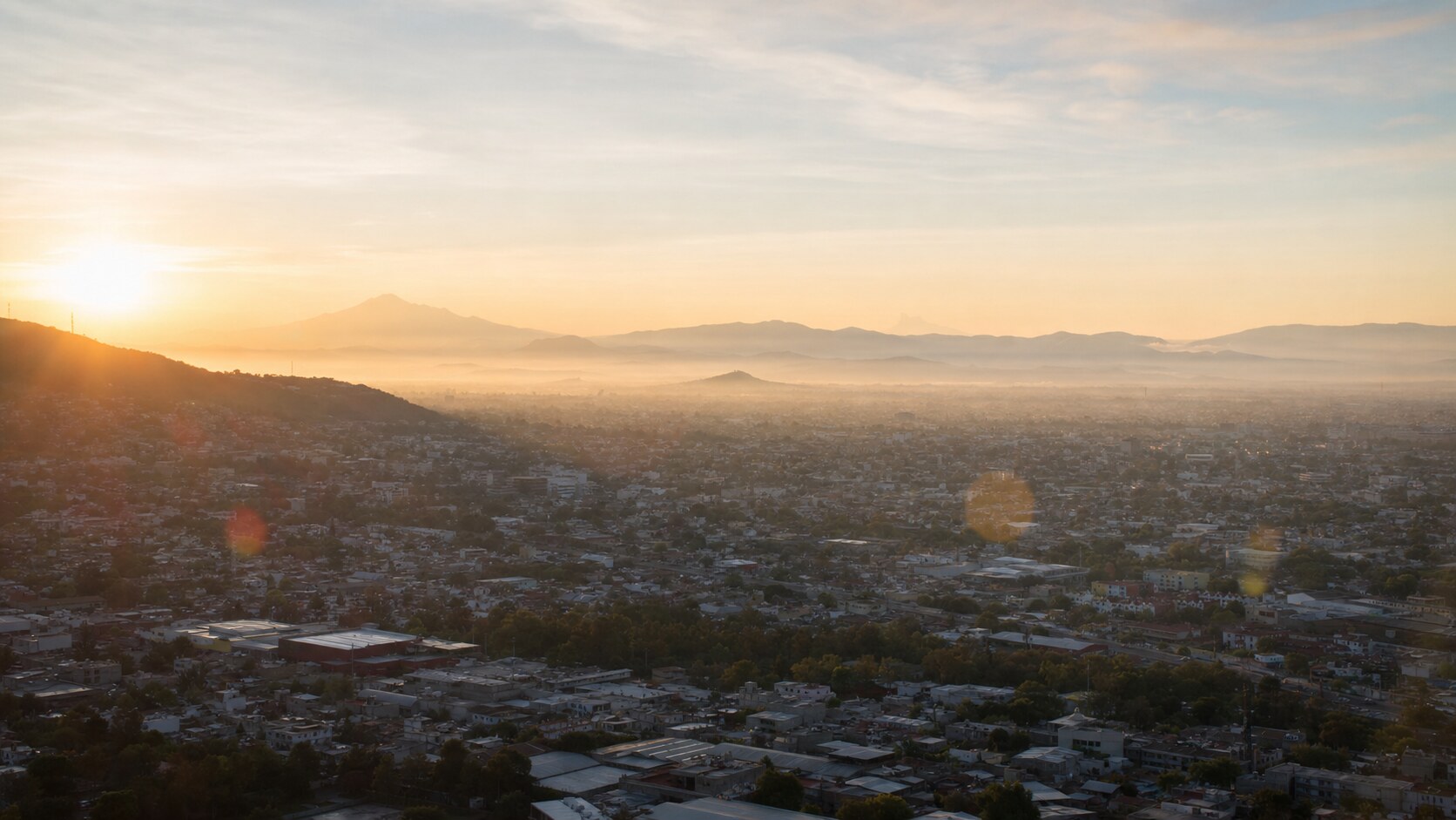Sunrise aerial-style view of Mexico City, the signature opening shot most photography tours begin with