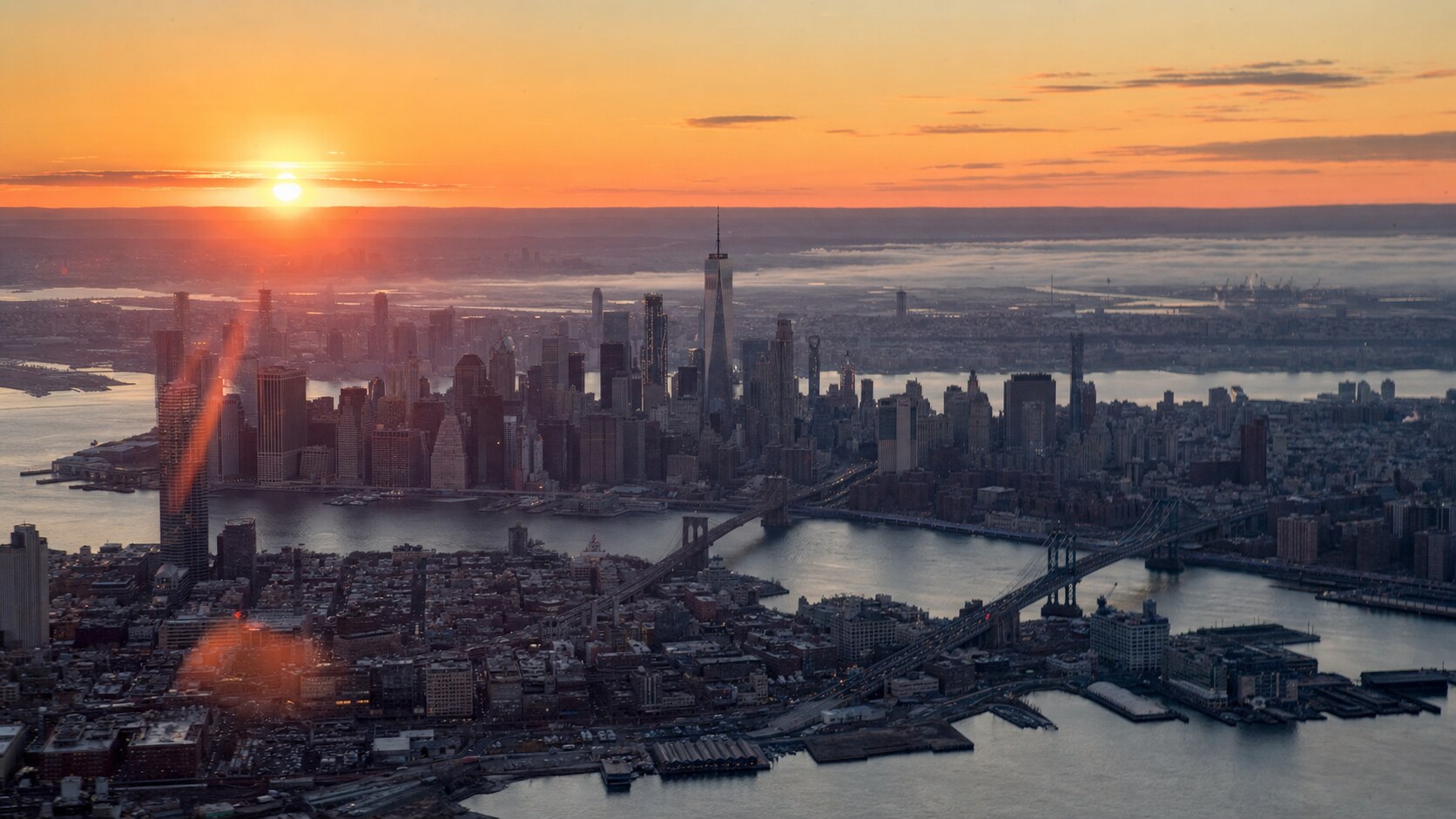 Sunrise aerial-style view of New York City, the signature opening shot most photography tours begin with