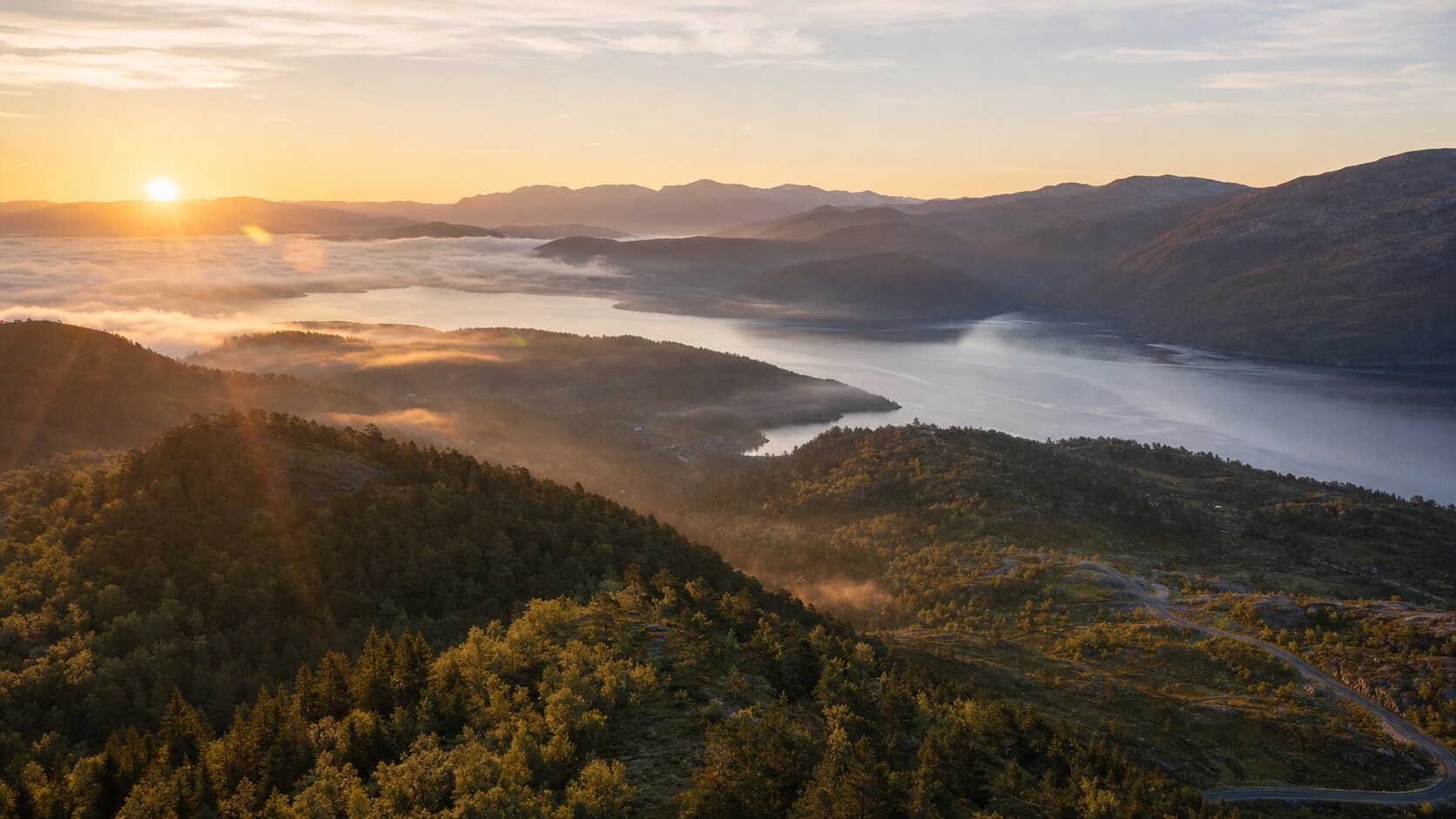 Sunrise aerial-style view of Norway, the signature opening shot most photography tours begin with