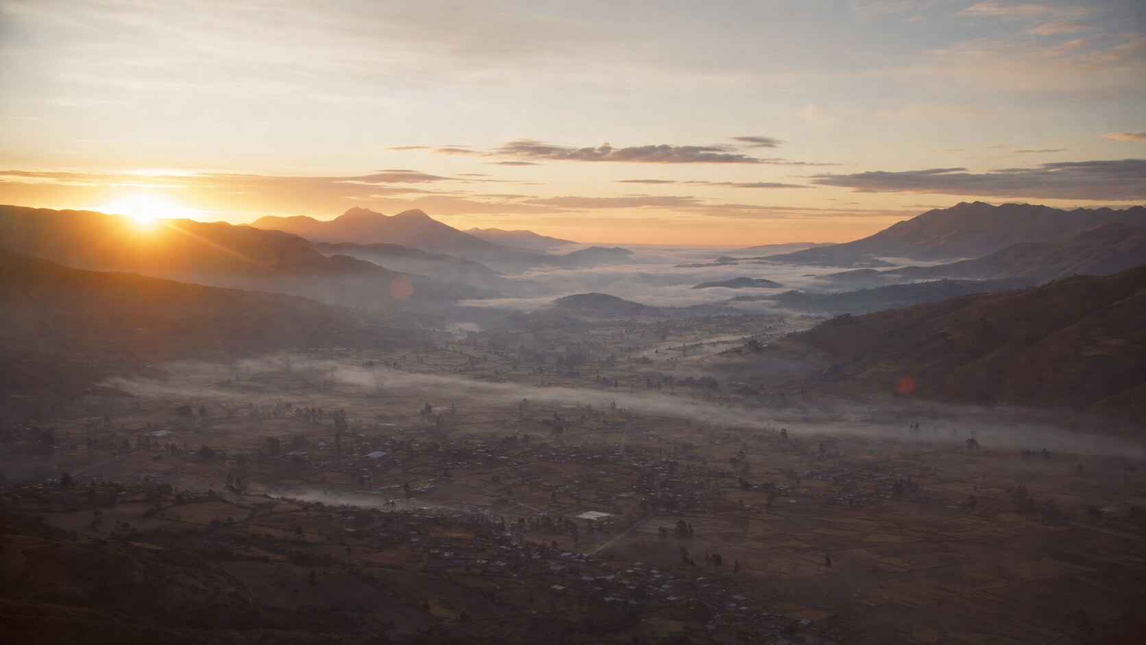 Sunrise aerial-style view of Peru, the signature opening shot most photography tours begin with