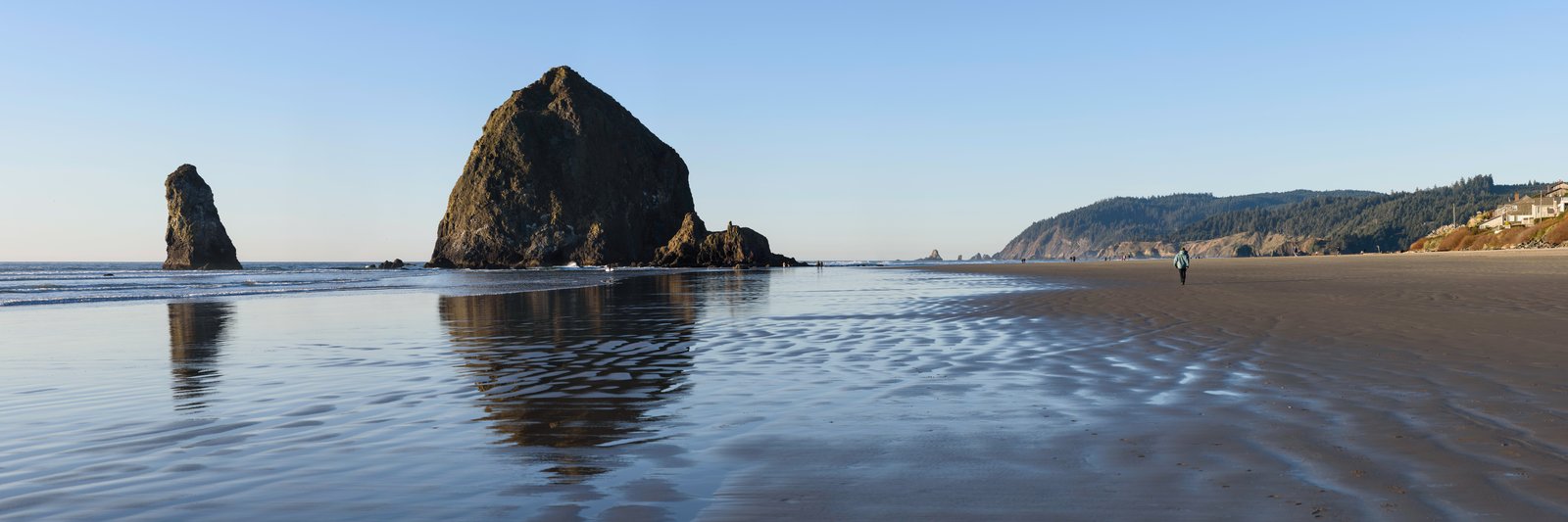 Panoramic view of Cannon Beach and Haystack Rock from the beach looking south on an autumn afternoon, Oregon