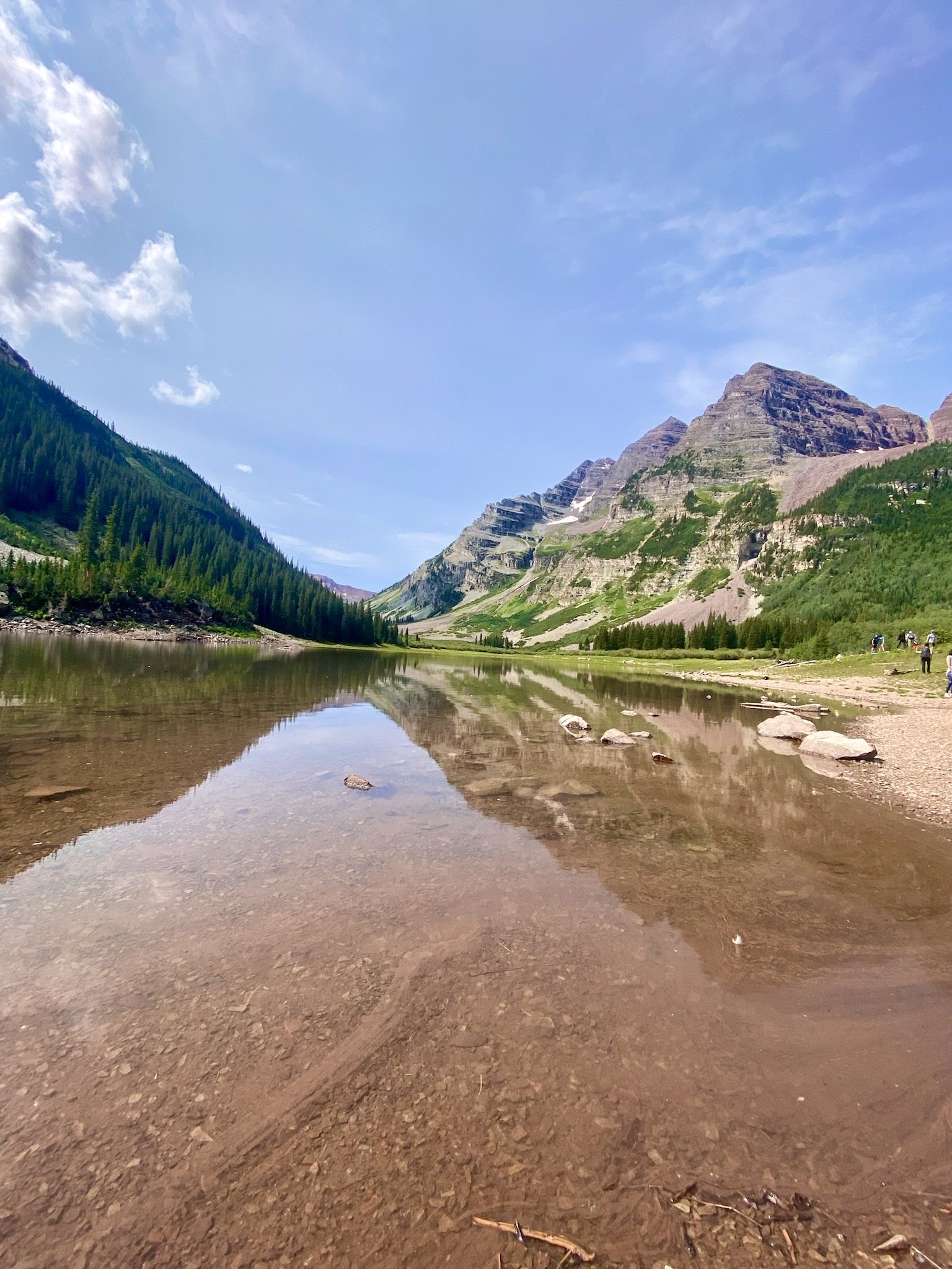 Crater Lake with Maroon Bells peaks rising above in the Maroon Bells-Snowmass Wilderness, Colorado