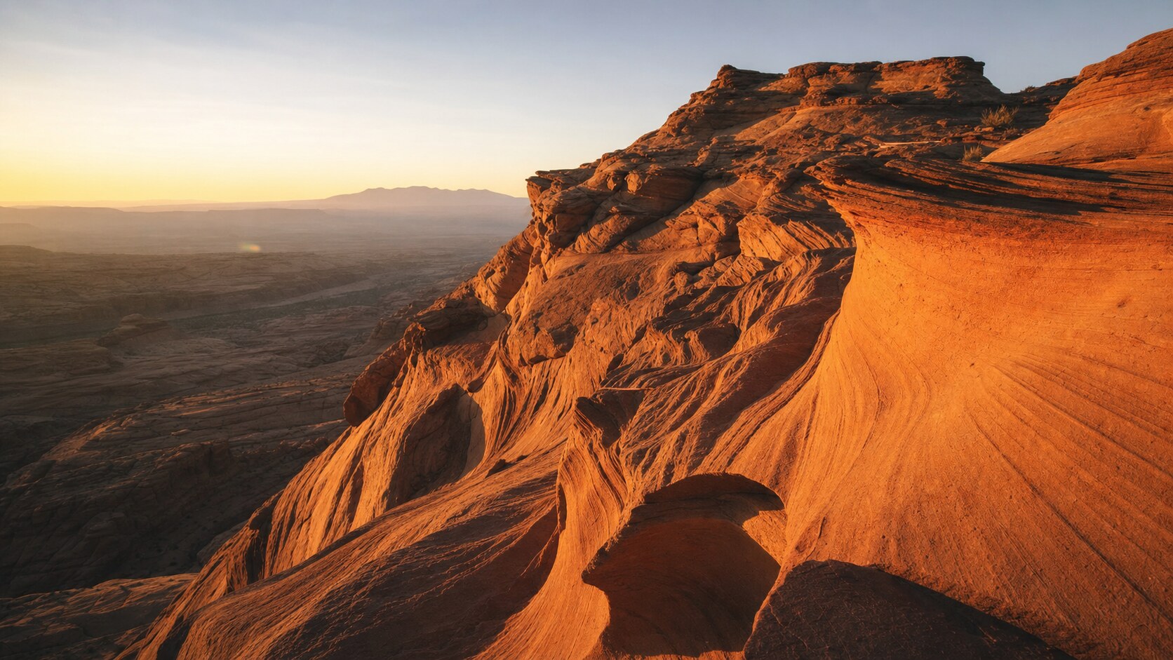 Antelope Canyon photographed at golden hour from the most popular hero-shot vantage point, with dramatic side-lighting on the structure