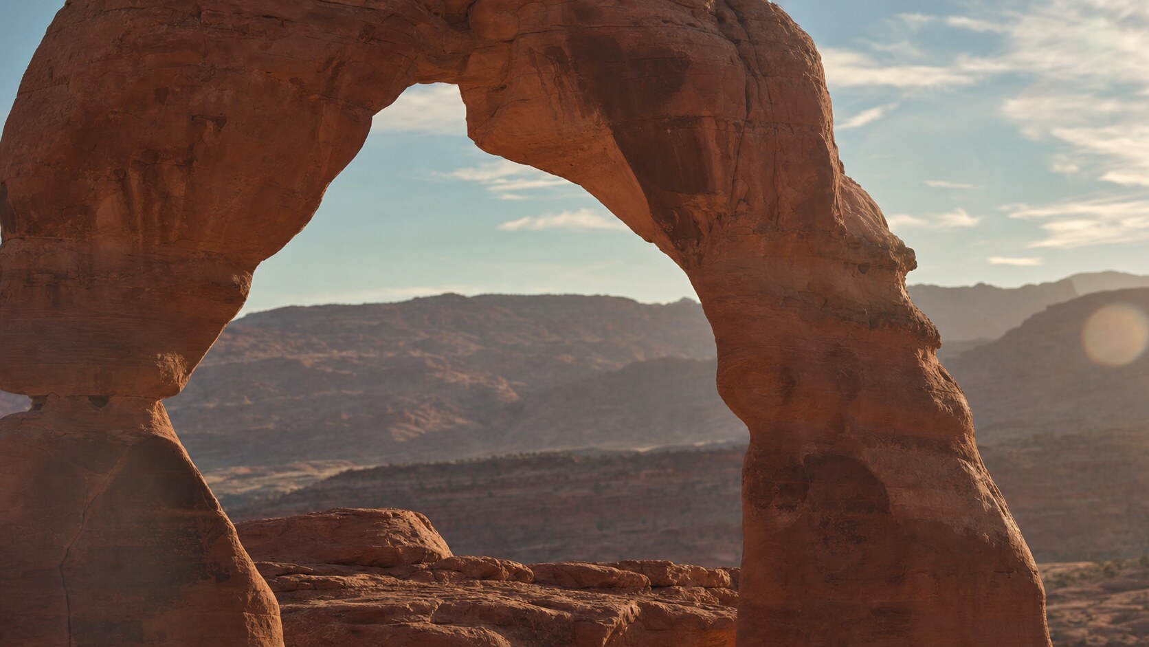 Close-up architectural detail of Delicate Arch at late afternoon, showing surface texture and material under directional sun