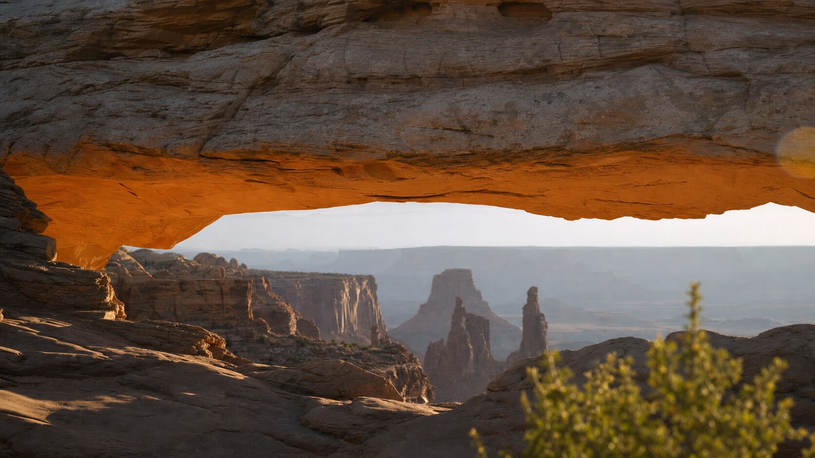 Close-up architectural detail of Mesa Arch at late afternoon, showing surface texture and material under directional sun