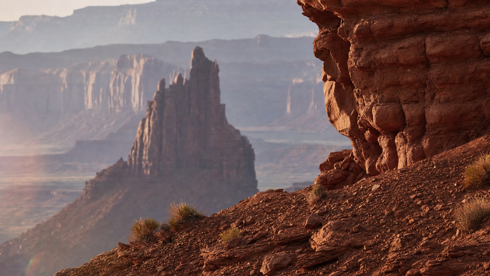 Close-up architectural detail of Monument Valley at late afternoon, showing surface texture and material under directional sun
