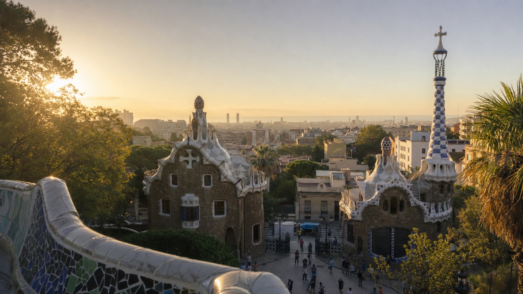 Park Guell photographed at golden hour from the most popular hero-shot vantage point, with dramatic side-lighting on the structure
