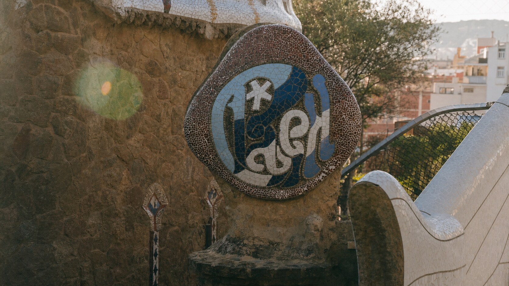 Close-up architectural detail of Park Guell at late afternoon, showing surface texture and material under directional sun