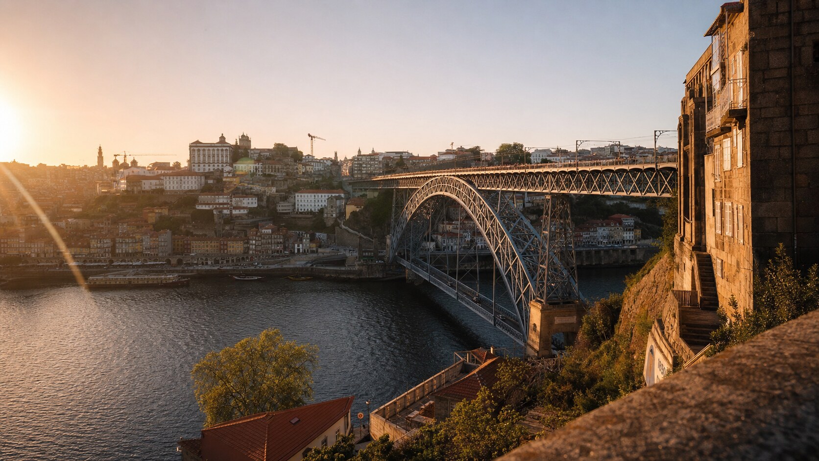 Ponte De Dom Luis photographed at golden hour from the most popular hero-shot vantage point, with dramatic side-lighting on the structure