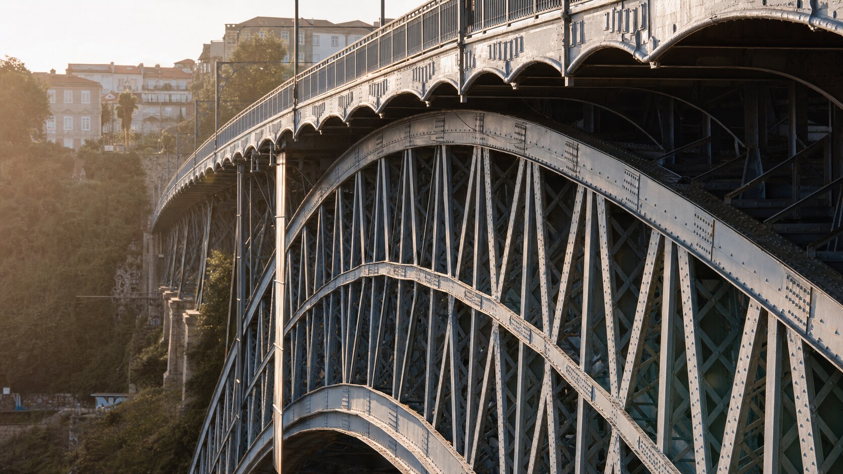 Close-up architectural detail of Ponte De Dom Luis at late afternoon, showing surface texture and material under directional sun
