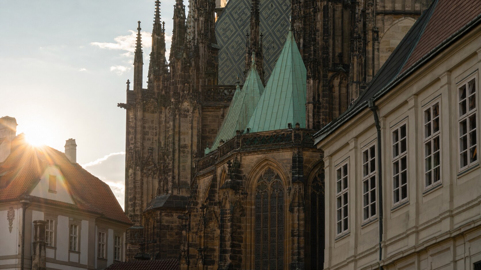 Close-up architectural detail of Prague Castle at late afternoon, showing surface texture and material under directional sun