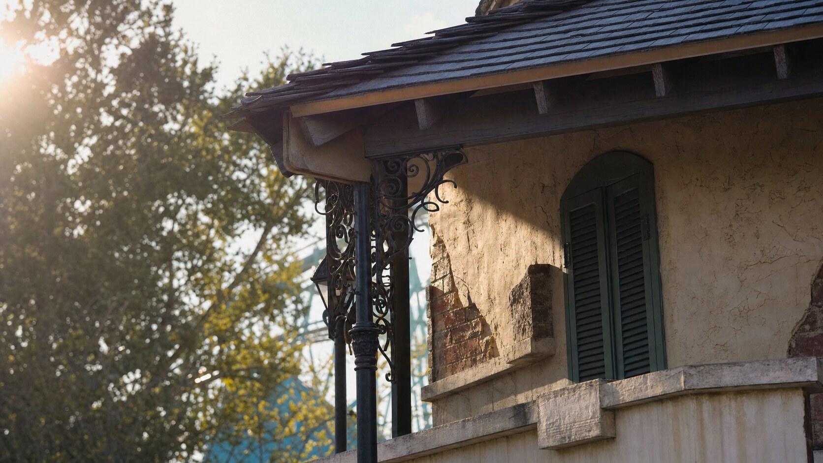 Close-up architectural detail of Six Flags New Orleans at late afternoon, showing surface texture and material under directional sun