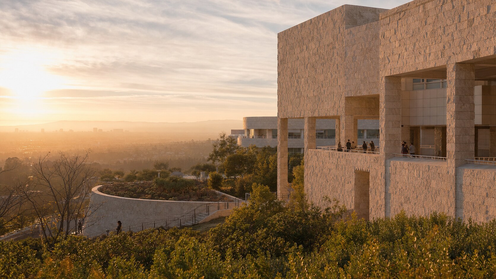 The Getty photographed at golden hour from the most popular hero-shot vantage point, with dramatic side-lighting on the structure