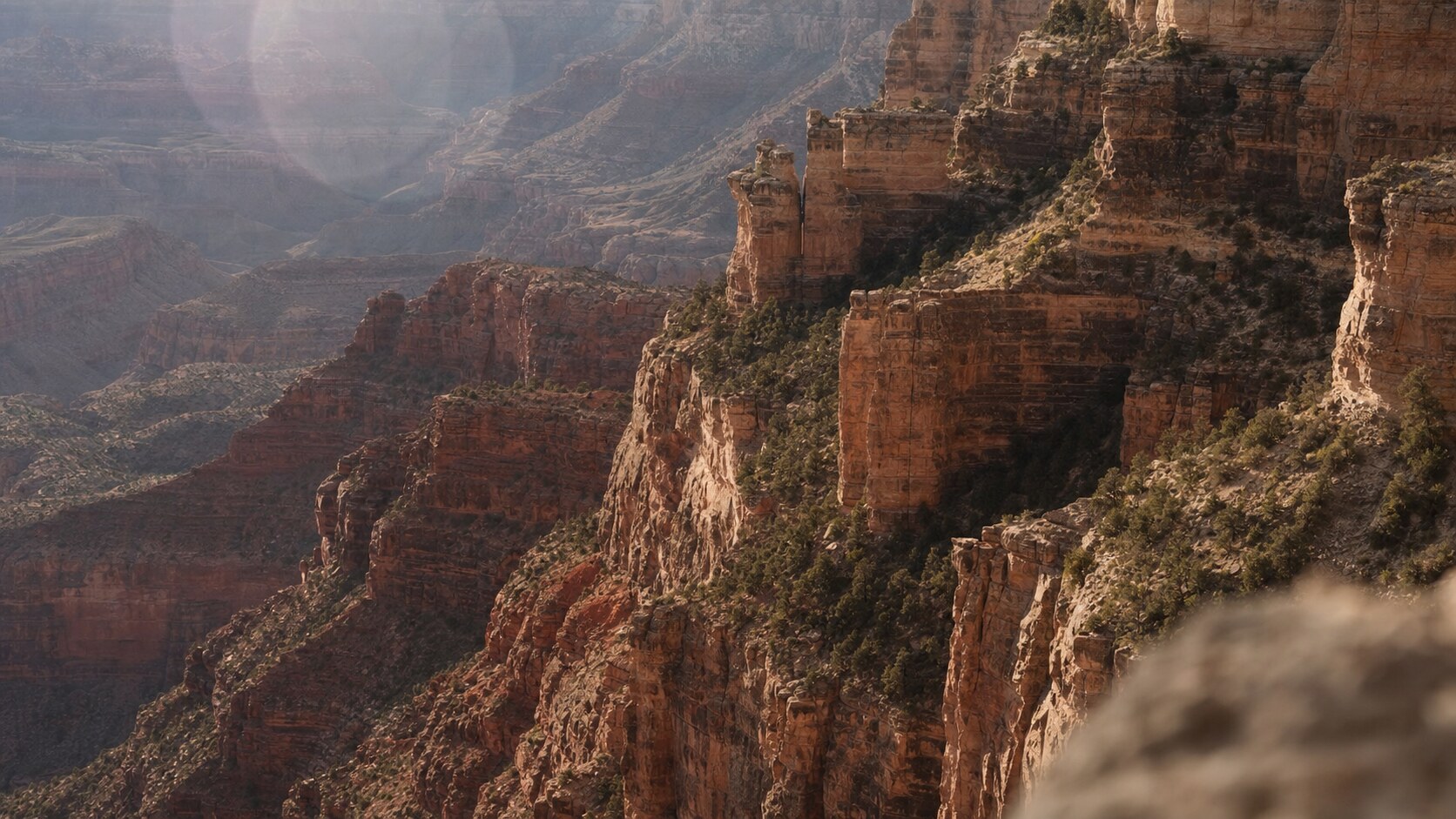 Close-up architectural detail of The Grand Canyon at late afternoon, showing surface texture and material under directional sun