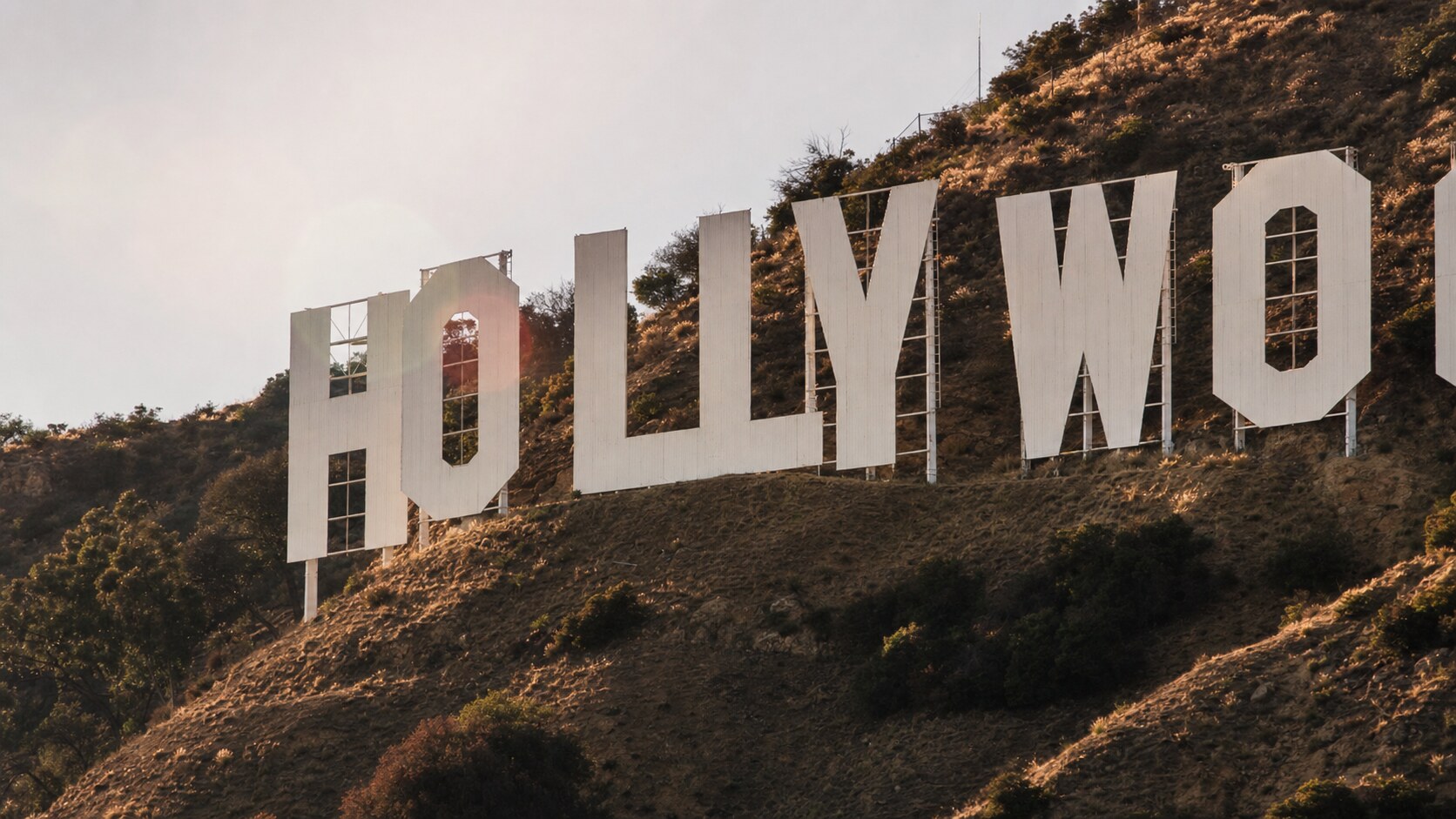 Close-up architectural detail of The Hollywood Sign at late afternoon, showing surface texture and material under directional sun