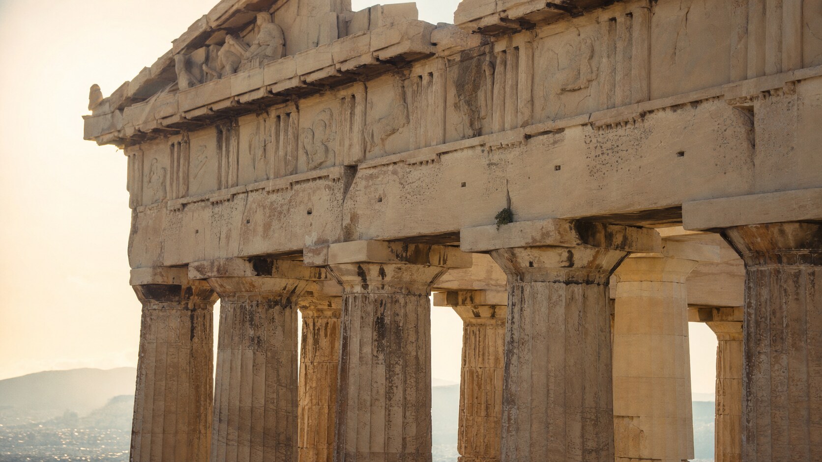 Close-up architectural detail of The Parthenon at late afternoon, showing surface texture and material under directional sun