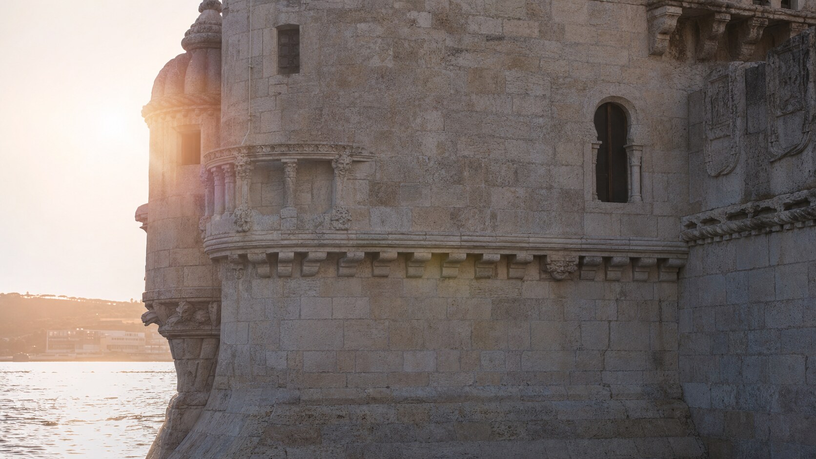 Close-up architectural detail of The Tower Of Belem at late afternoon, showing surface texture and material under directional sun