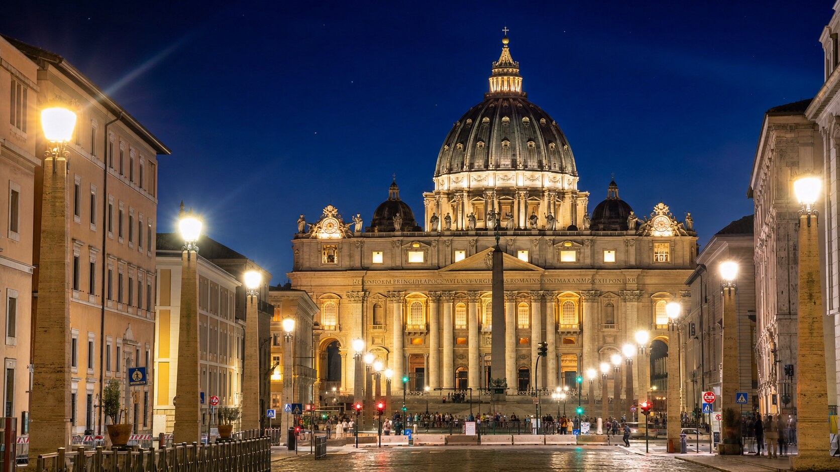 Wide blue-hour view of The Vatican with cobalt sky and warm artificial lighting on the landmark