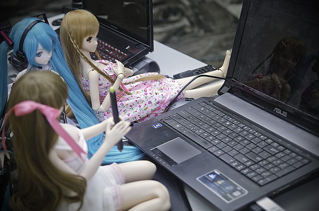 Modern editing suite with dual monitors showing AI editing software automatically culling sharp images.