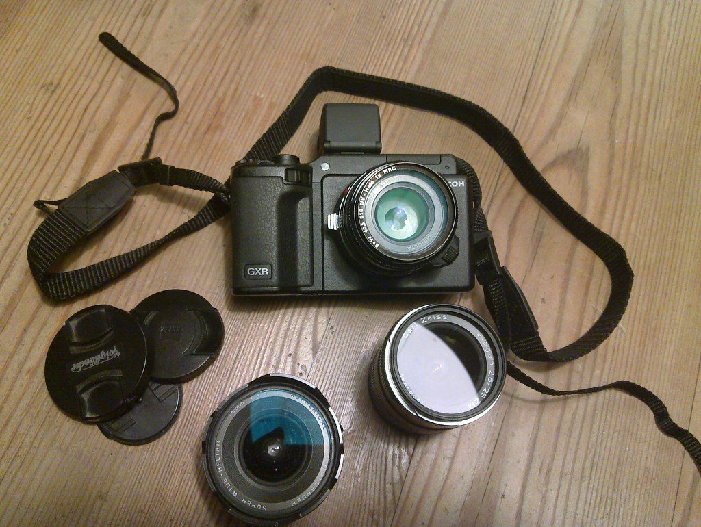 Modern mirrorless camera on a tripod during a blue hour shoot for a professional gear review.