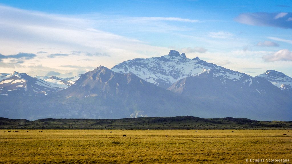 AI photo editing software identifying mountain peaks and nature elements in a landscape photo.