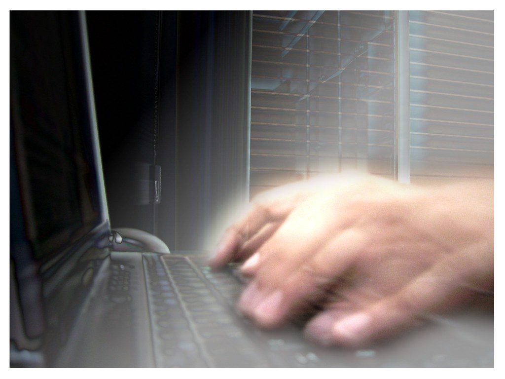 Close-up of a professional using the best photo editing software for Milky Way noise reduction.