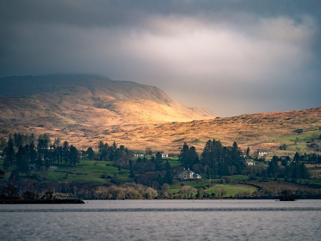 A photographer uses an editing console to enhance a landscape photo, showing how to edit like a pro.