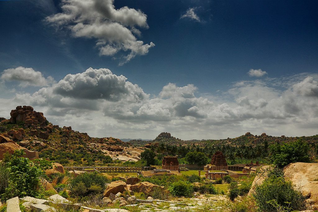 Professional monitor displaying AI photo editing software analyzing a mountain landscape.