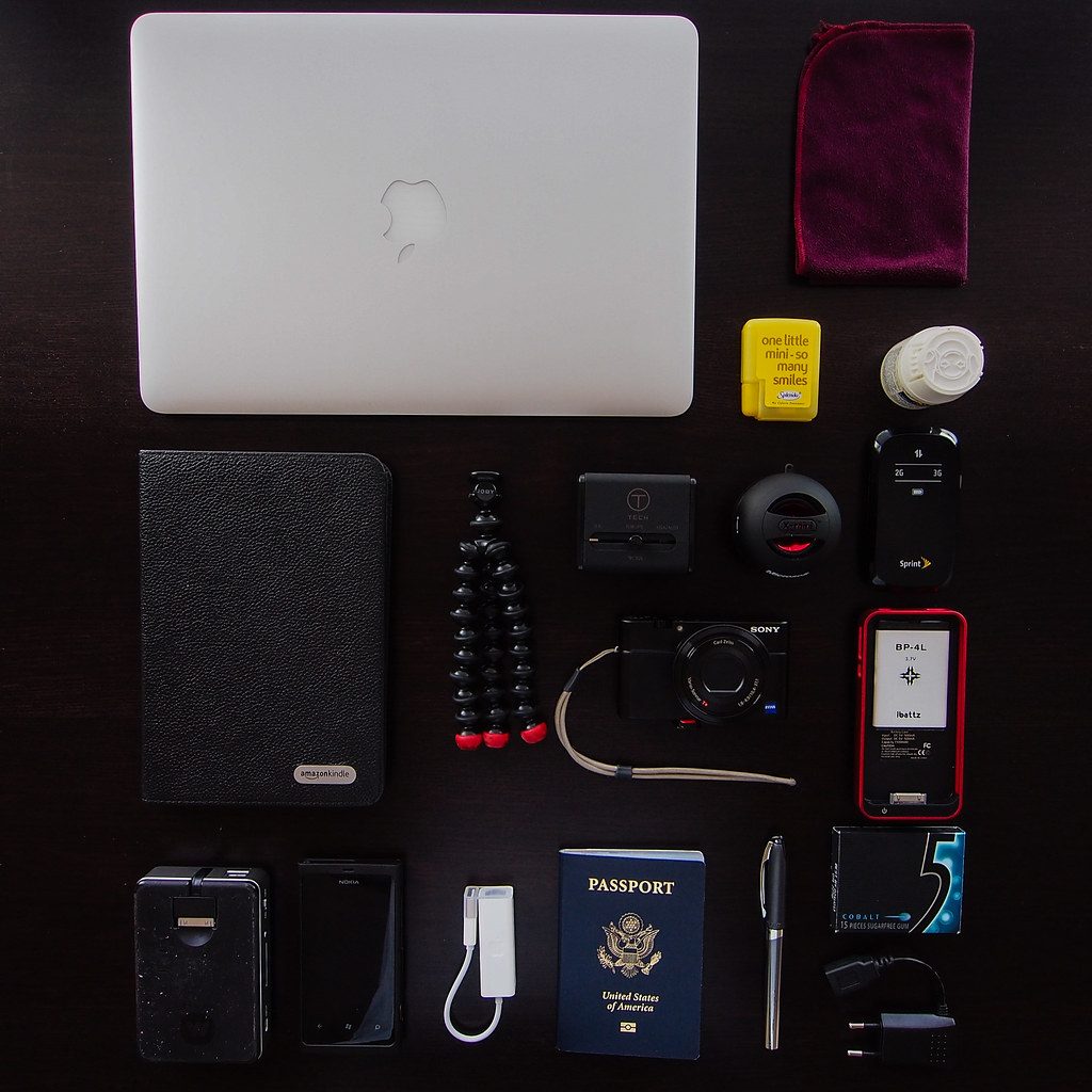 Professional workspace with laptop and camera using modern tools for RAW photo editing.