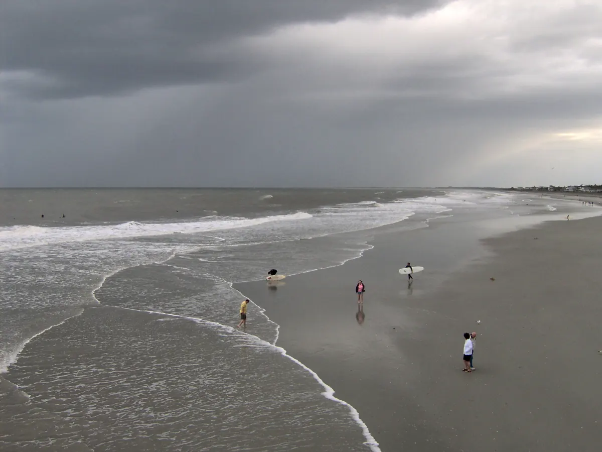 Wide coastal landscape of Folly Beach pier near Charleston, South Carolina demonstrating a travel photography composition.