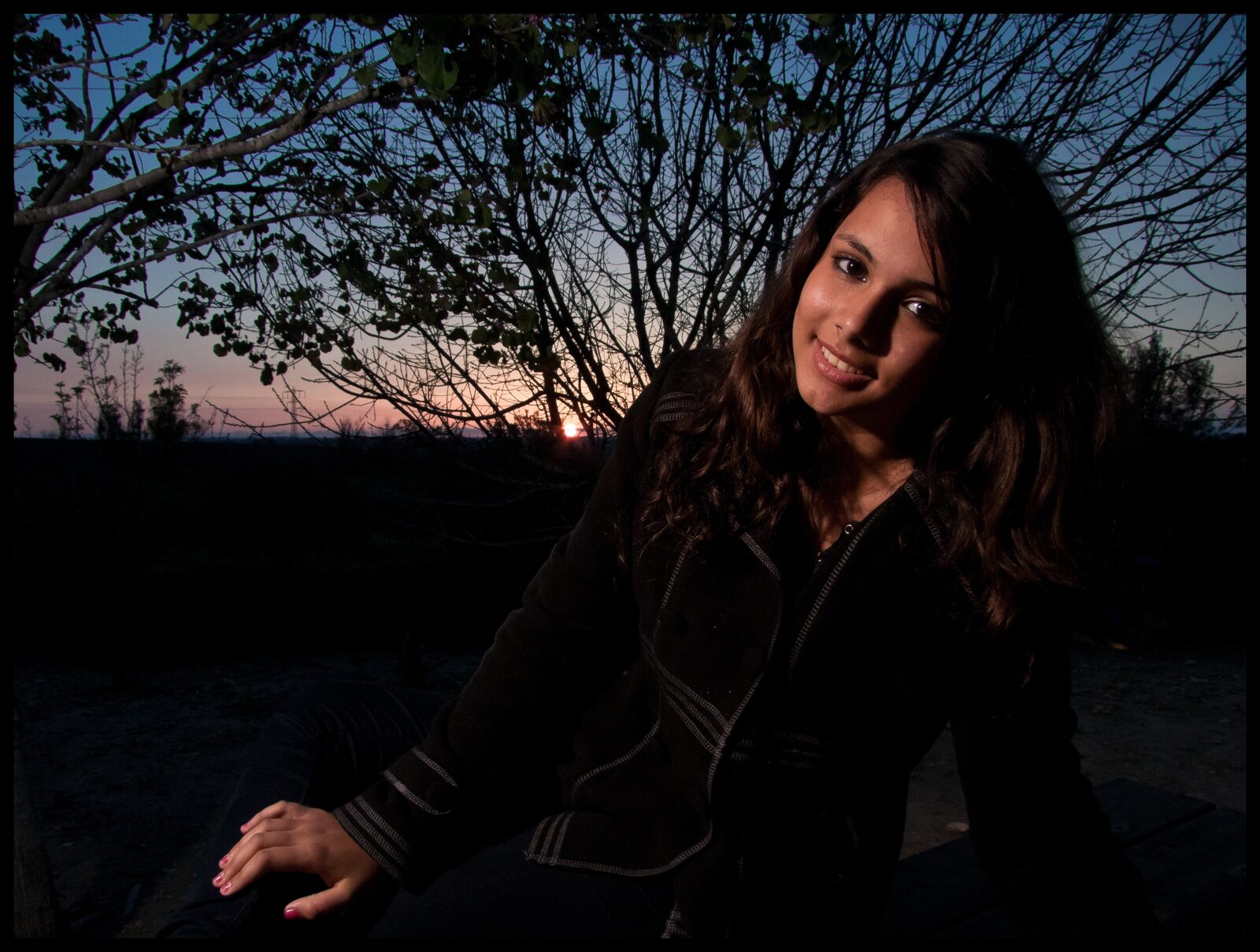 Photographer and model working an outdoor portrait session in soft natural light, practising composition and expression