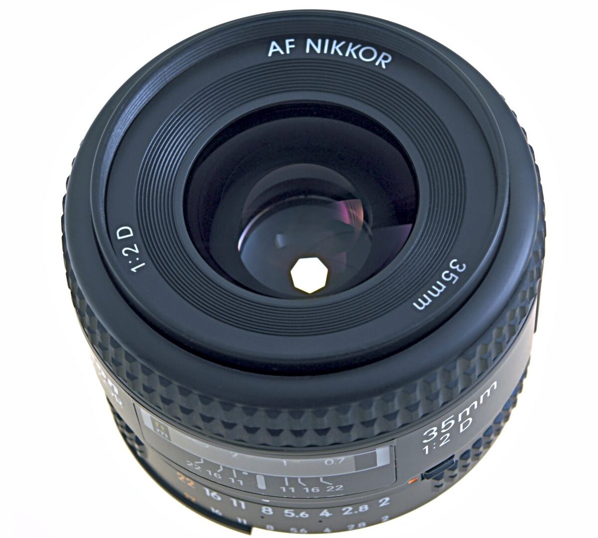 Lens diaphragm blades forming a small aperture inside a camera lens with control ring