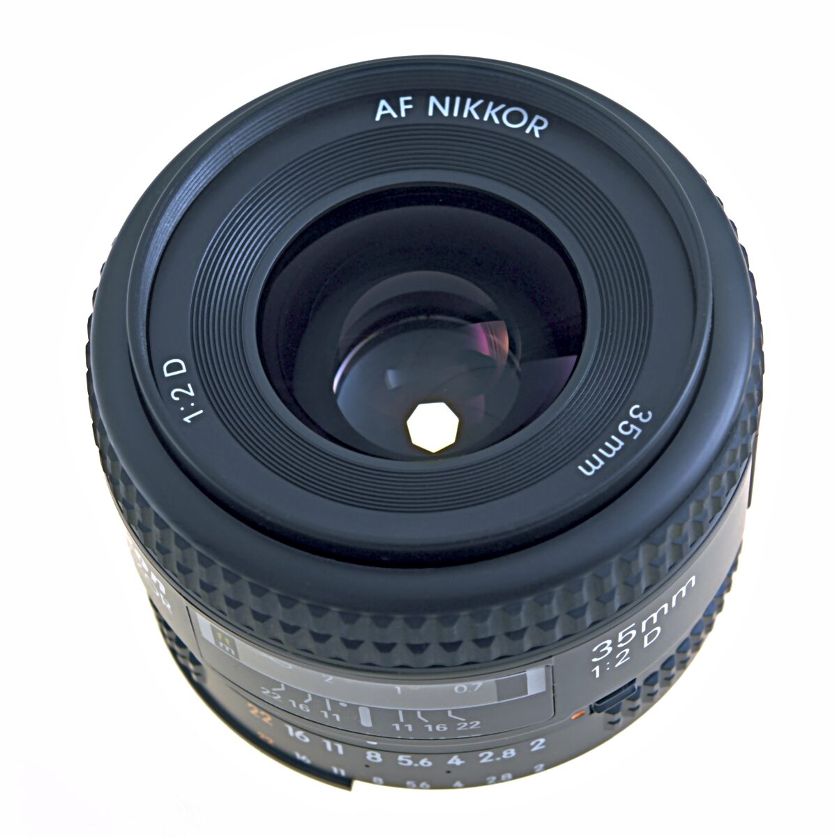 Lens diaphragm blades forming a small aperture inside a camera lens with control ring
