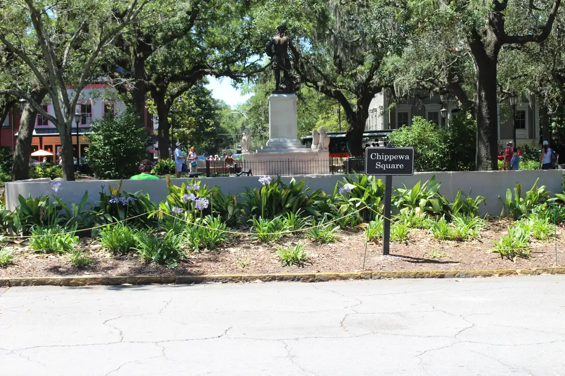 Live oak canopy over Chippewa Square in Savannah Historic District demonstrating a travel photography composition.