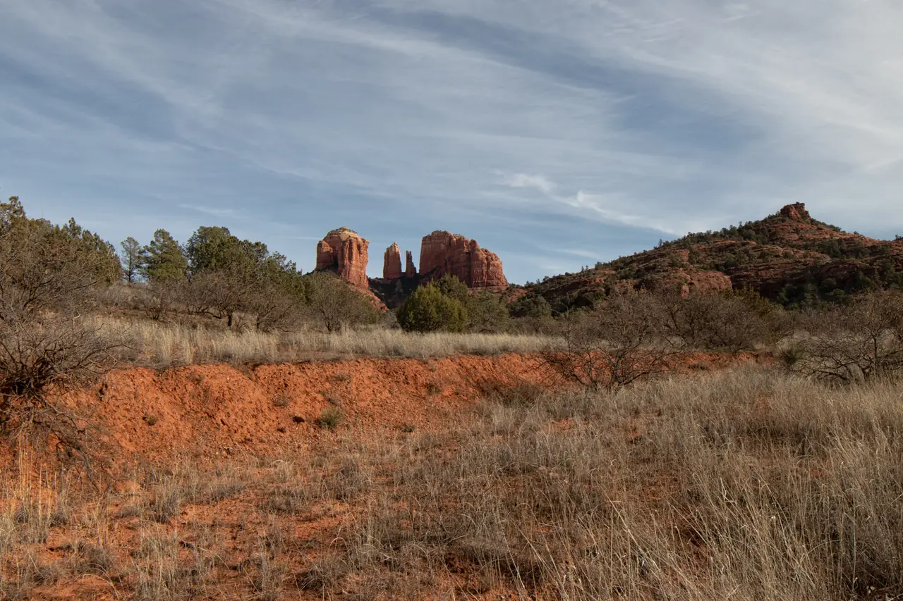 Warm sidelight on Cathedral Rock in Sedona, Arizona demonstrating a travel photography composition.