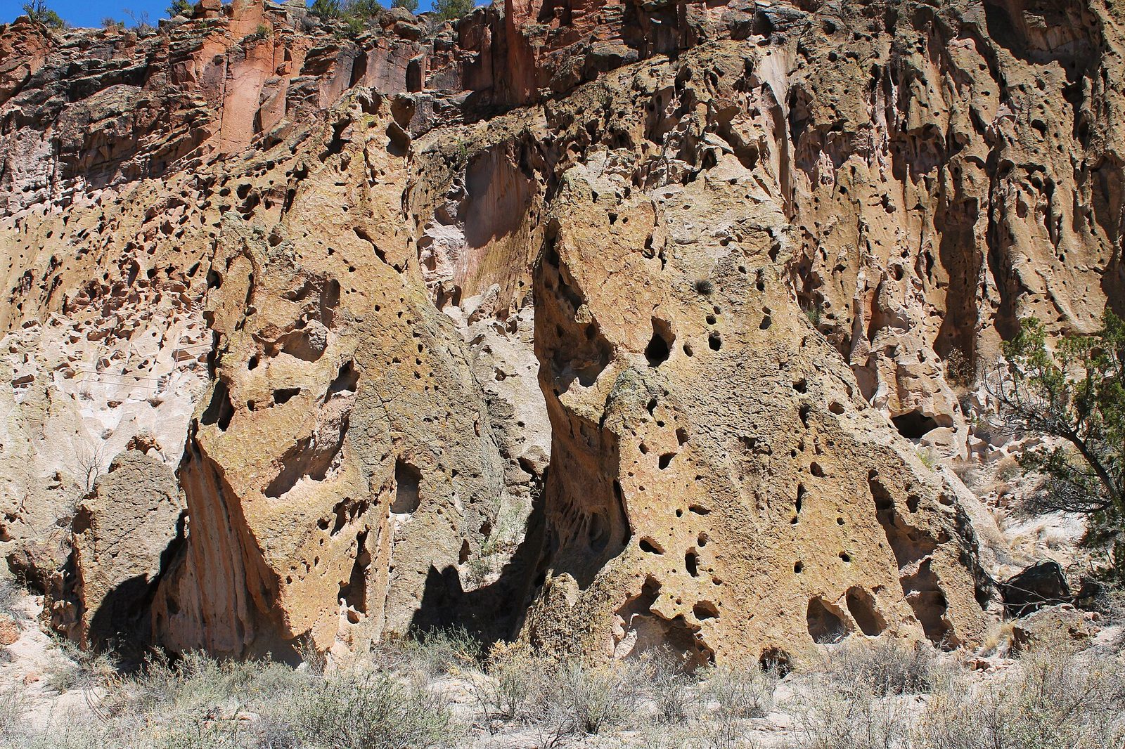 Cliff dwellings of Bandelier National Monument near Santa Fe, New Mexico demonstrating a travel photography composition.