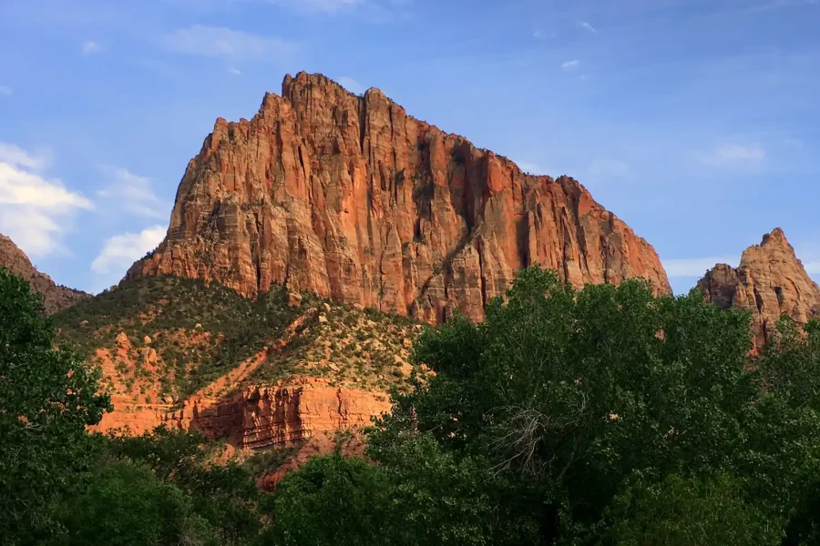 Golden hour landscape of The Watchman in Zion National Park, Utah demonstrating a travel photography composition.