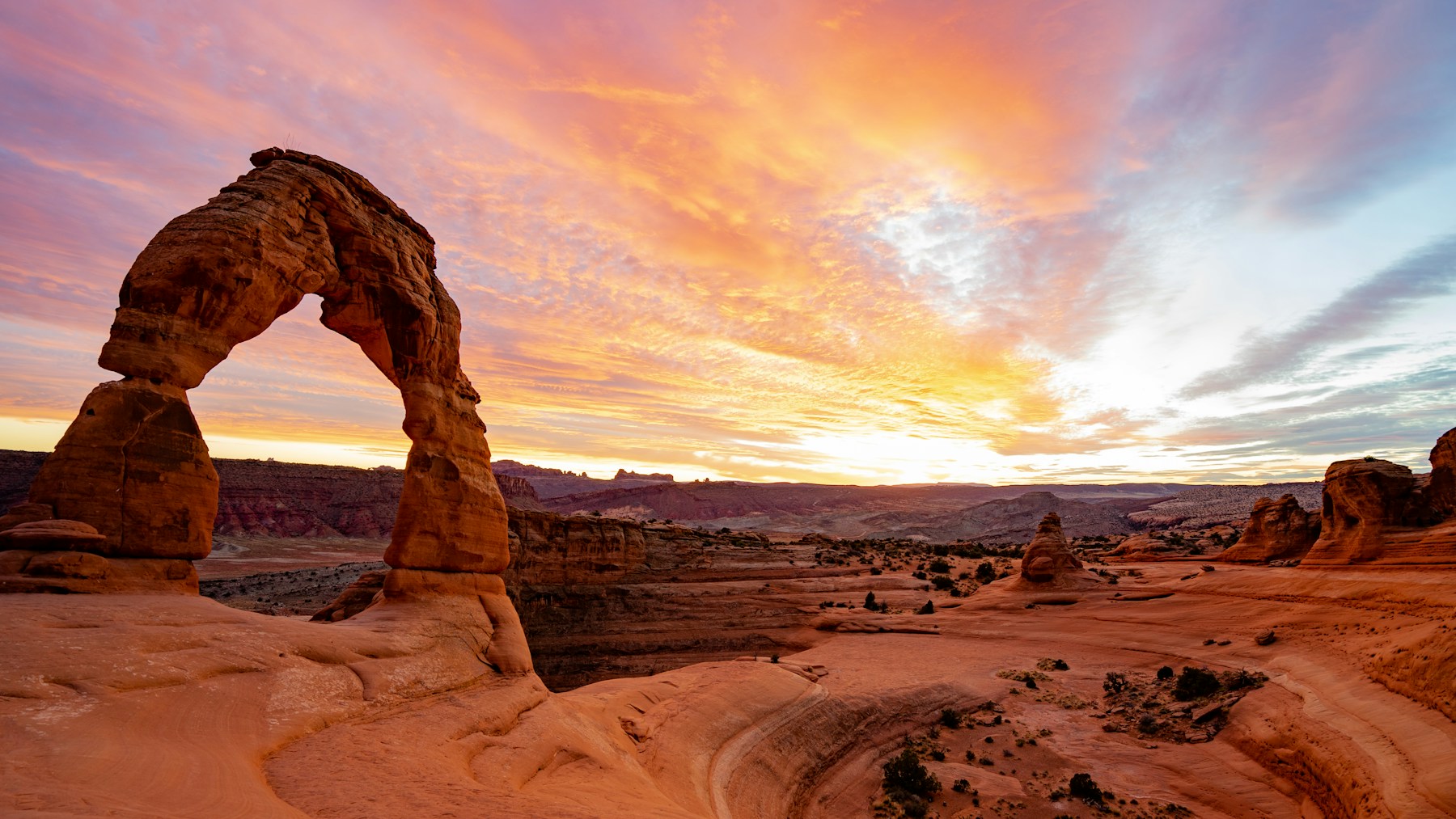 Delicate Arch glowing at sunset in Arches National Park