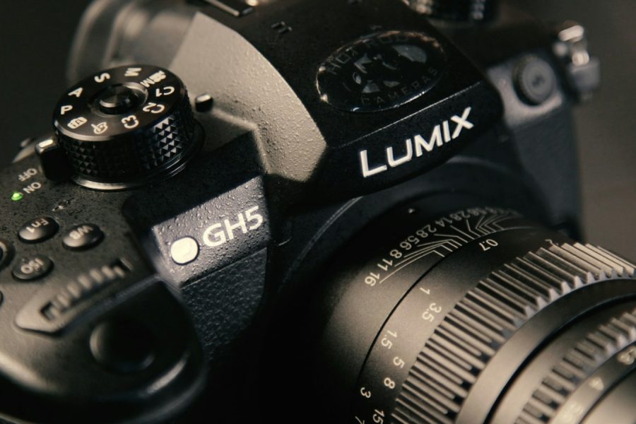 Close-up of a Panasonic Lumix GH5 camera showing the GH5 badge and mode dial