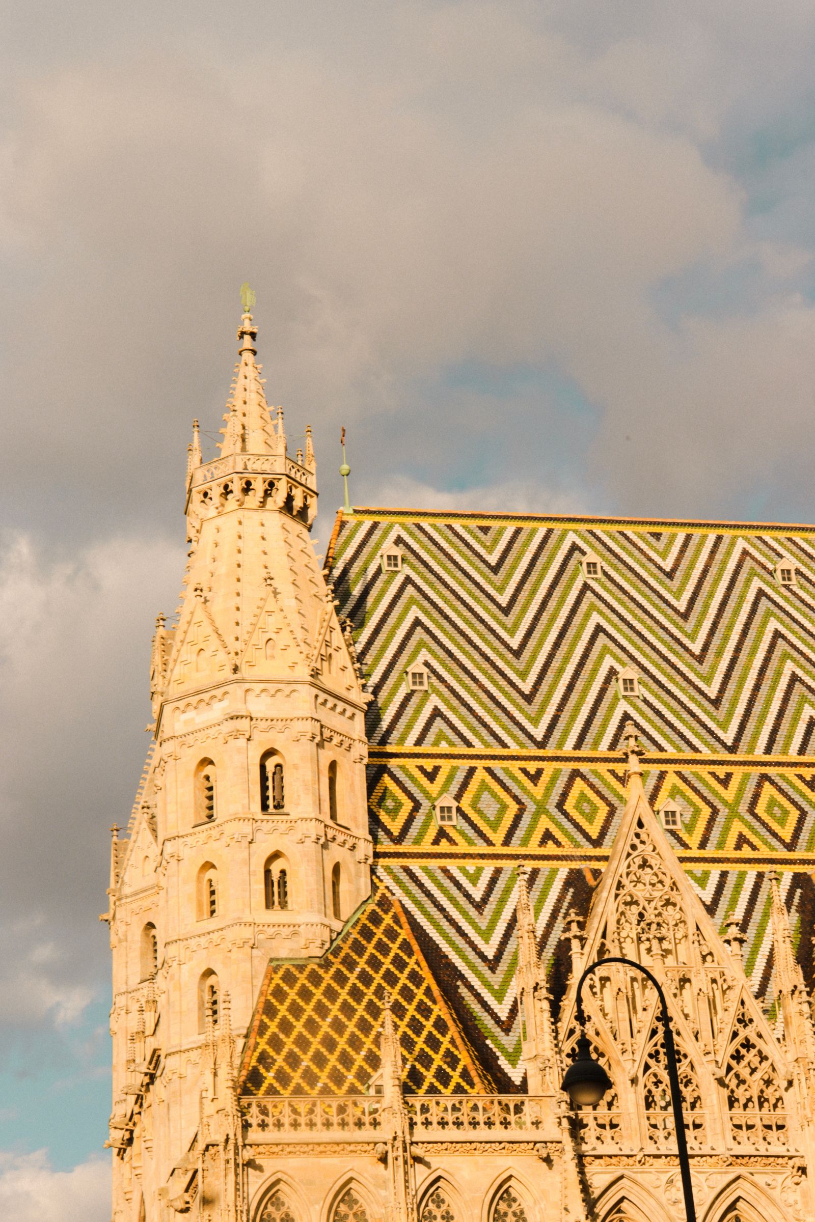 Vienna's St. Stephen's Cathedral and patterned tile roof in warm evening light