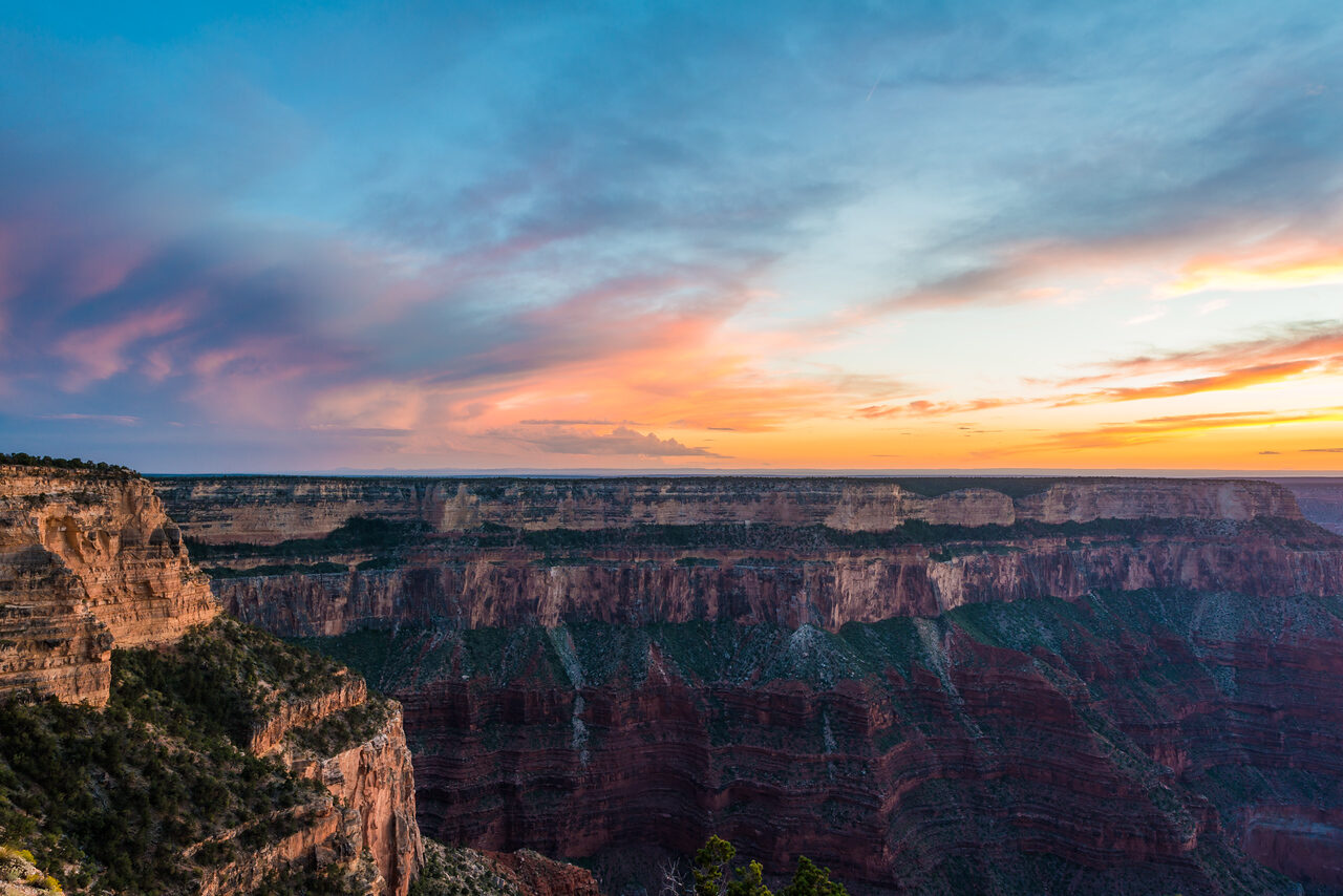 Sony ZV-E10 II Landscape Settings to Test - Grand Canyon rim beneath pink sunset clouds, photographed by Edin Chavez