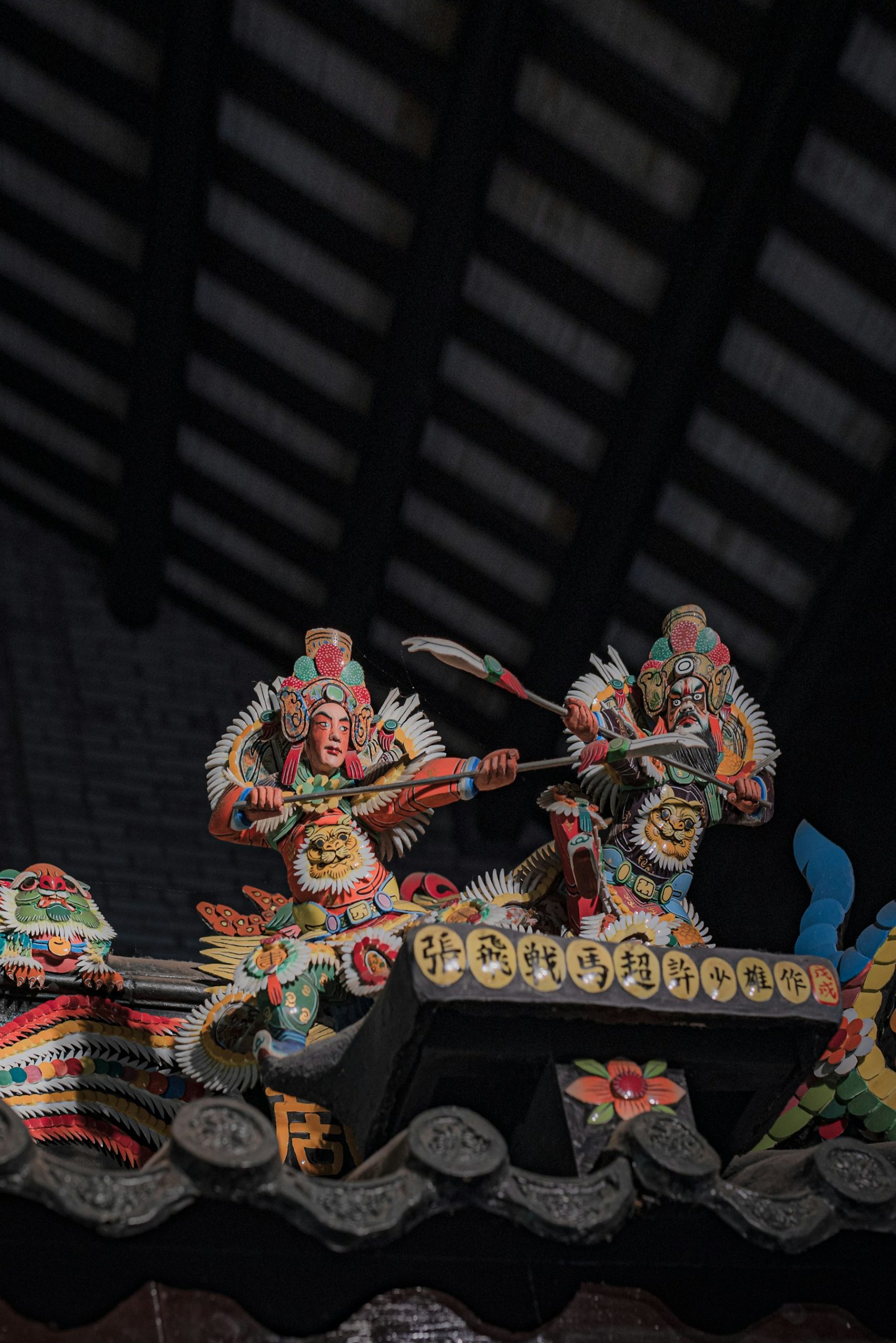 Ceramic warrior sculptures on Chen Clan Ancestral Hall roof