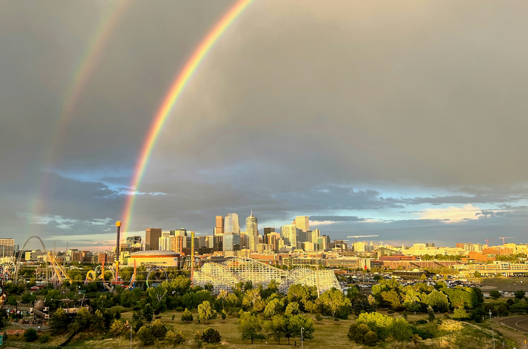Double rainbow over the Denver skyline after a storm