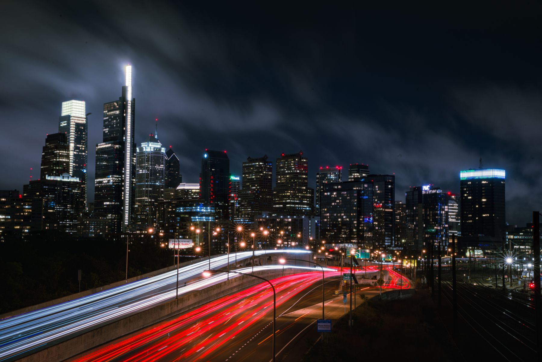 Philadelphia skyline and traffic light trails at night