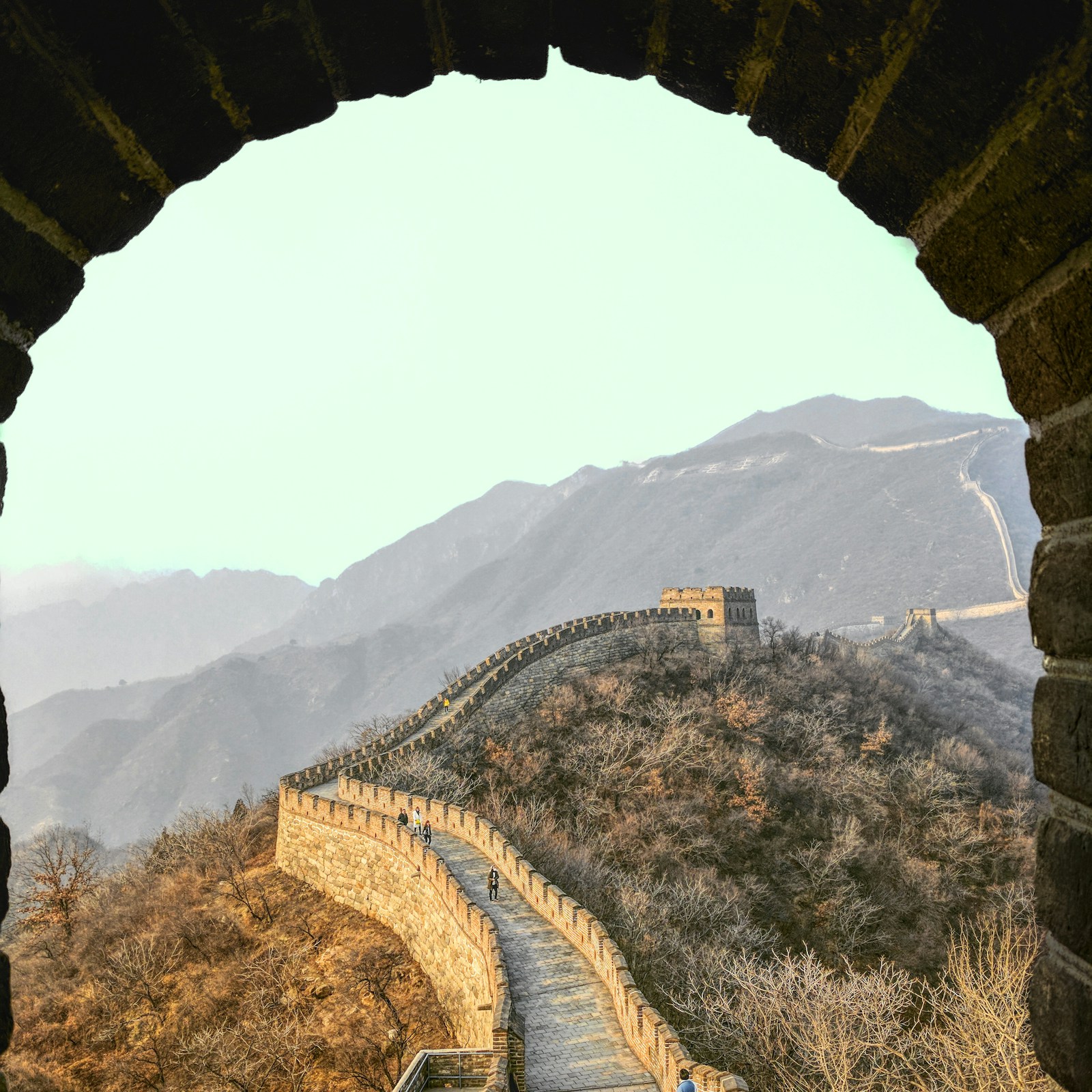 Great Wall at Mutianyu curving toward watchtowers through mountain hills