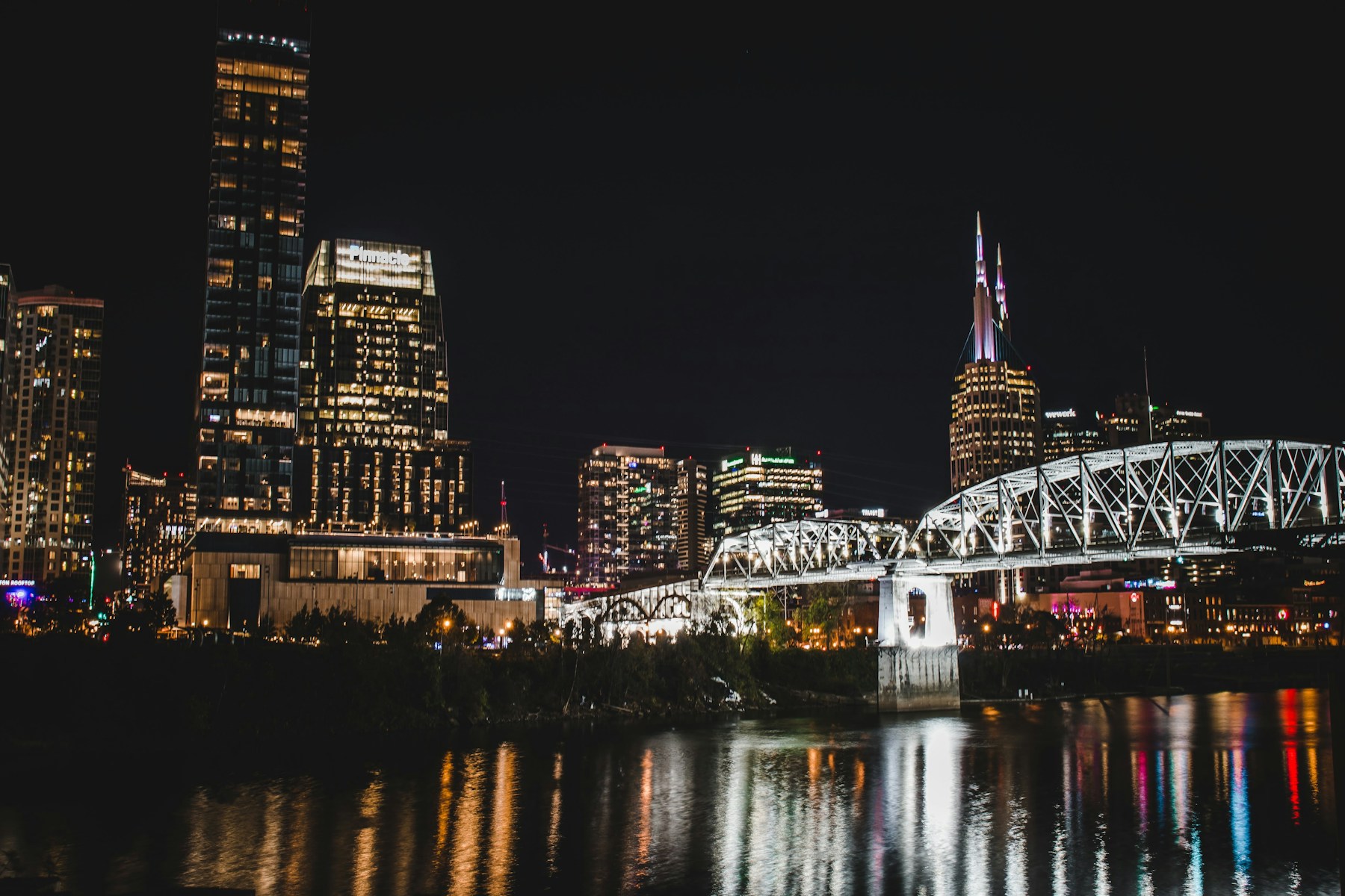 Nashville skyline and Cumberland River bridge at night