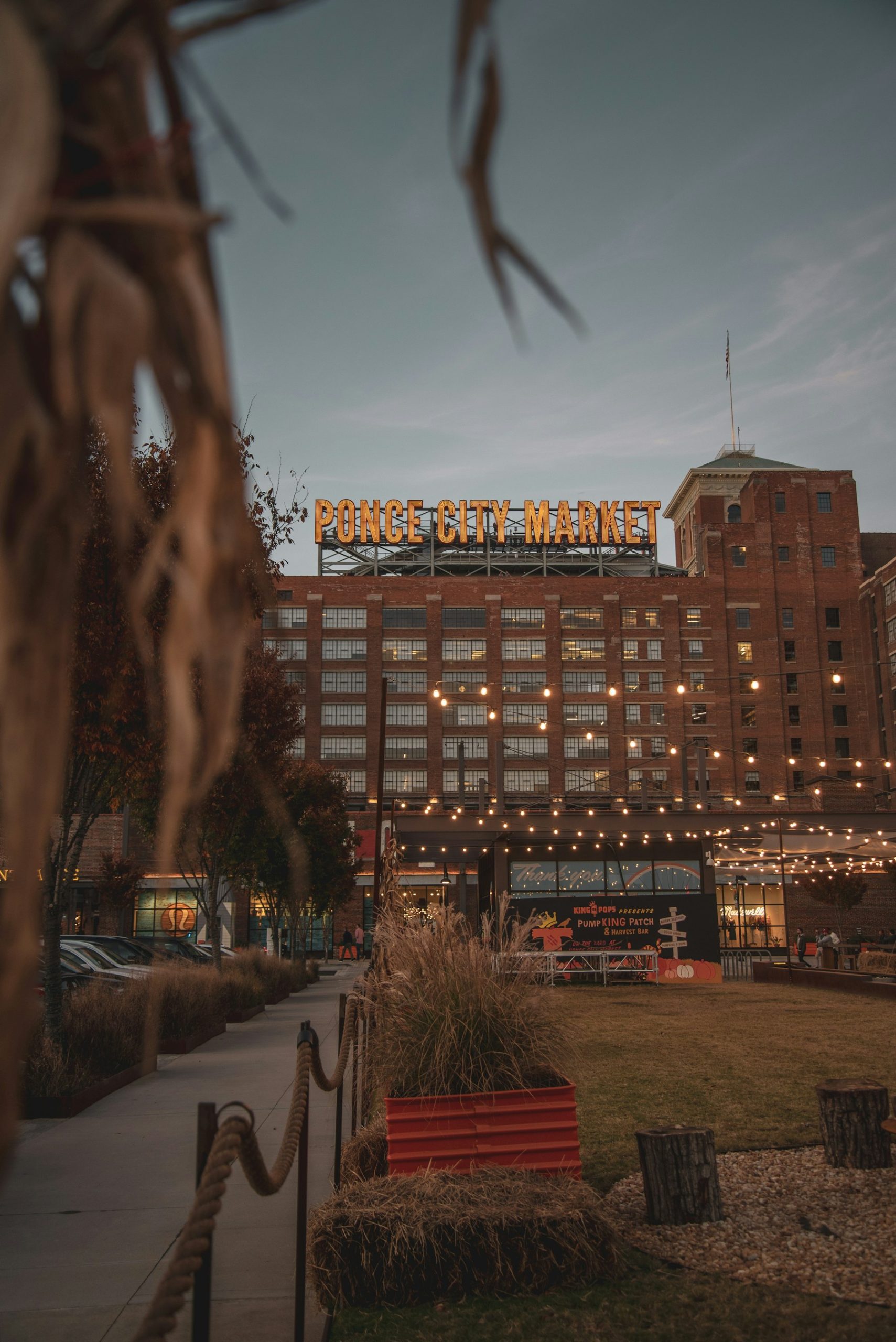 Ponce City Market brick facade and rooftop sign at dusk